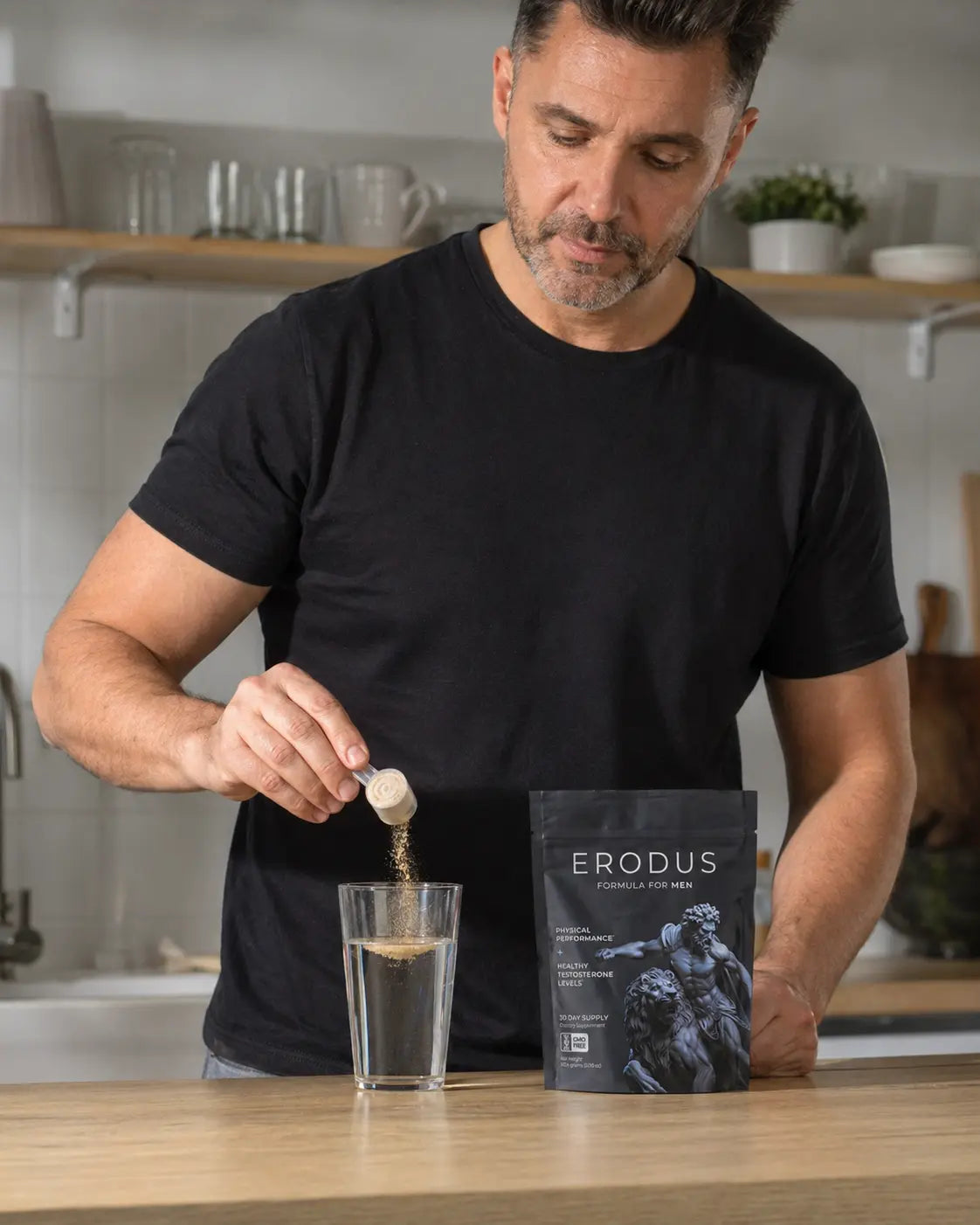 Man preparing Erodus supplement in a kitchen